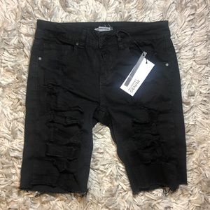 Black ripped Bermuda shorts
